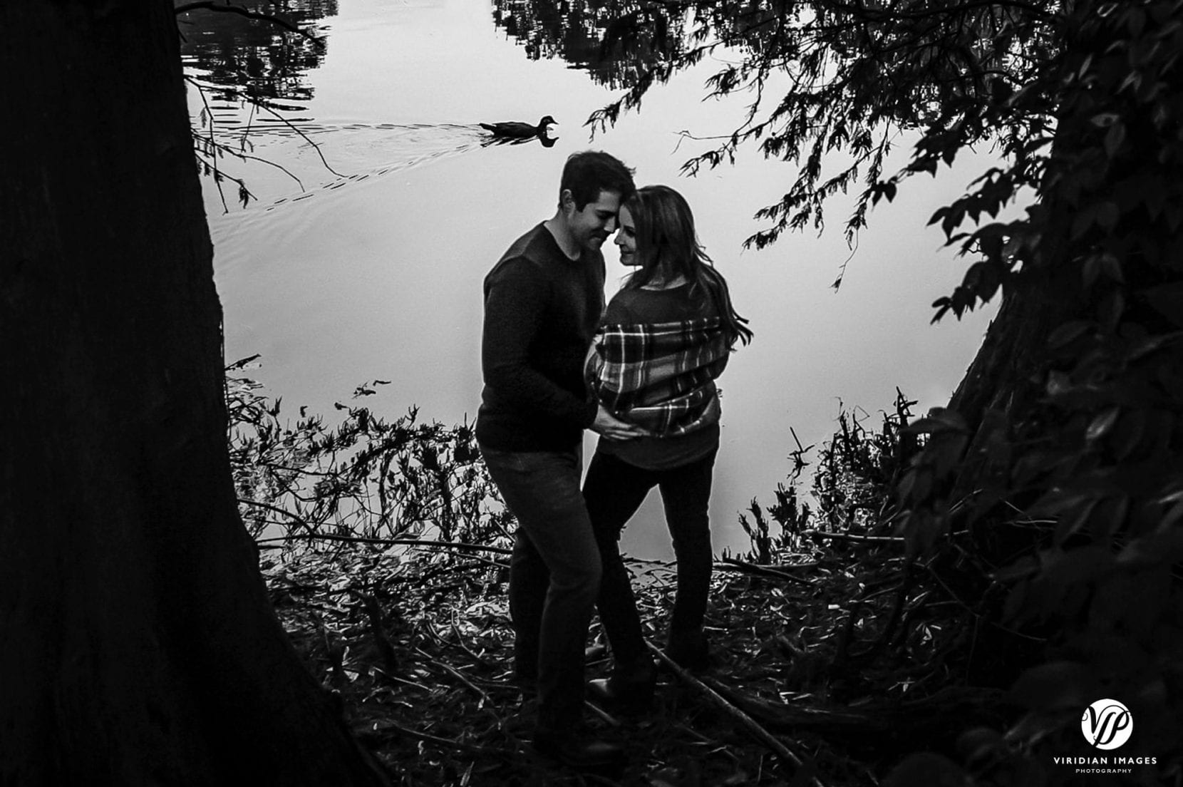 black and white engagement photo at piedmont park with duck