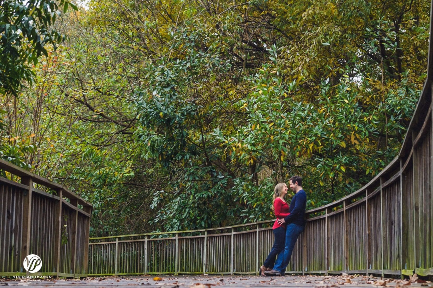 couple stop along boardwalk at piedmont park