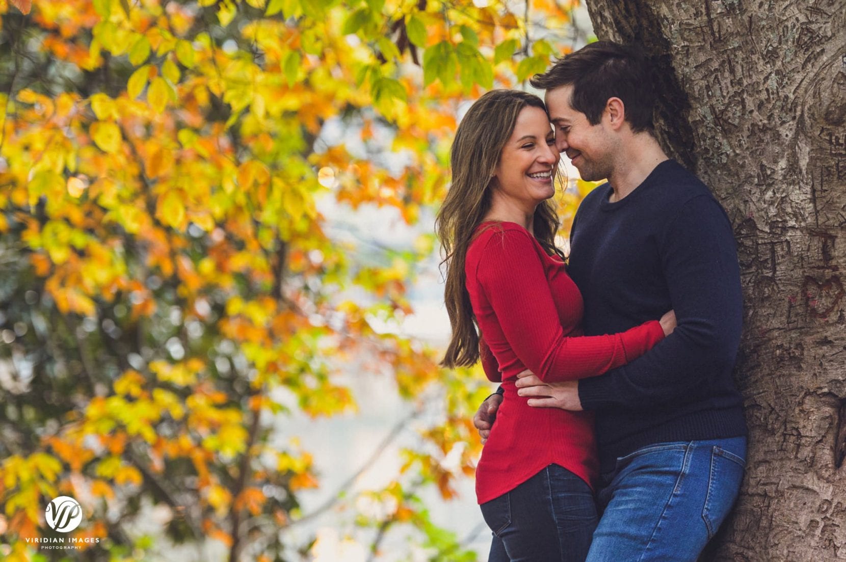 fall engagement photos at piedmont park couple embrace