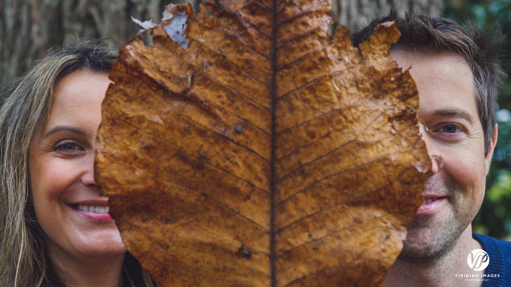 creative portrait with large color leaf at piedmont park