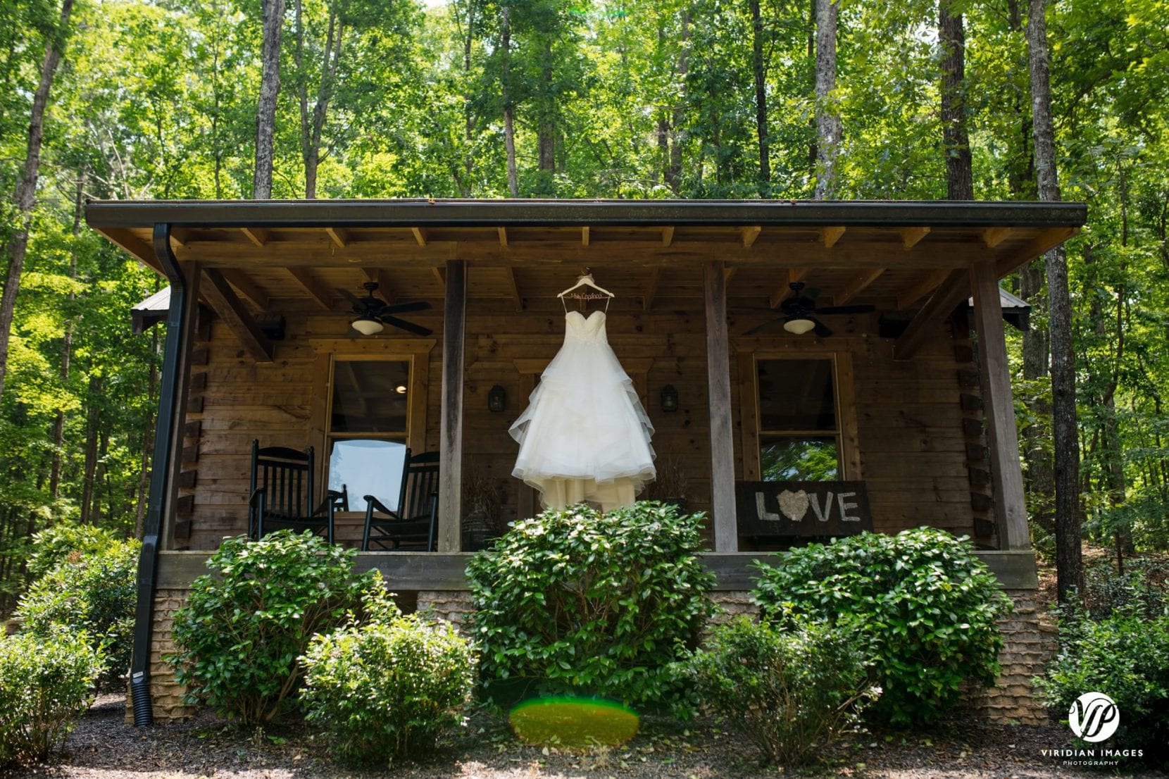 wedding dress hanging in front of bridal cabin