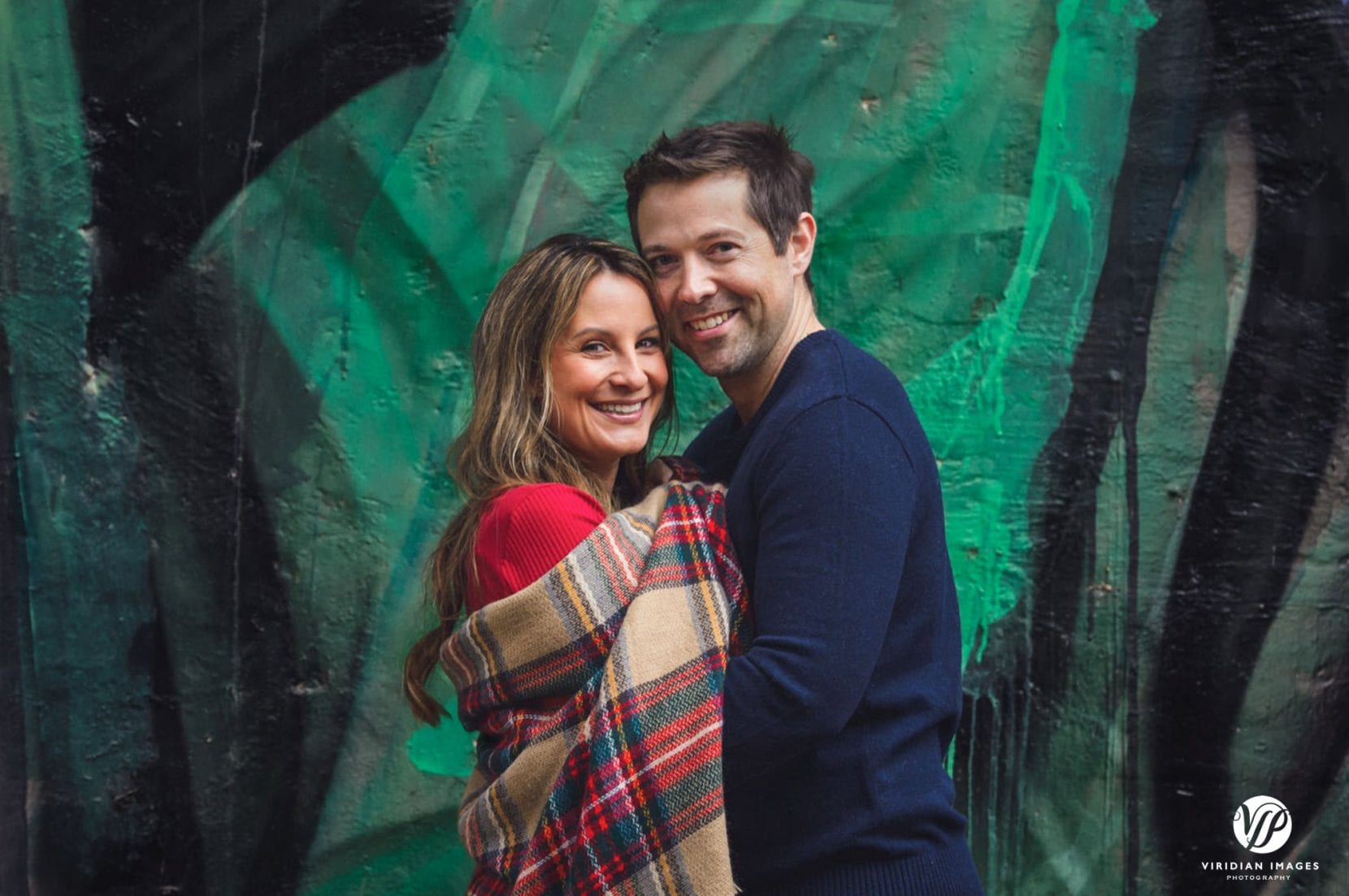 couple portrait in front of mural at Piedmont Park