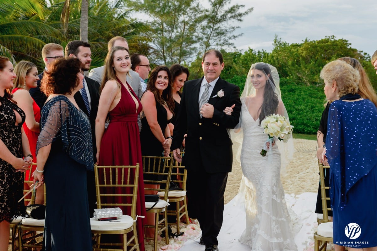 Secrets Capri bride walking down beach