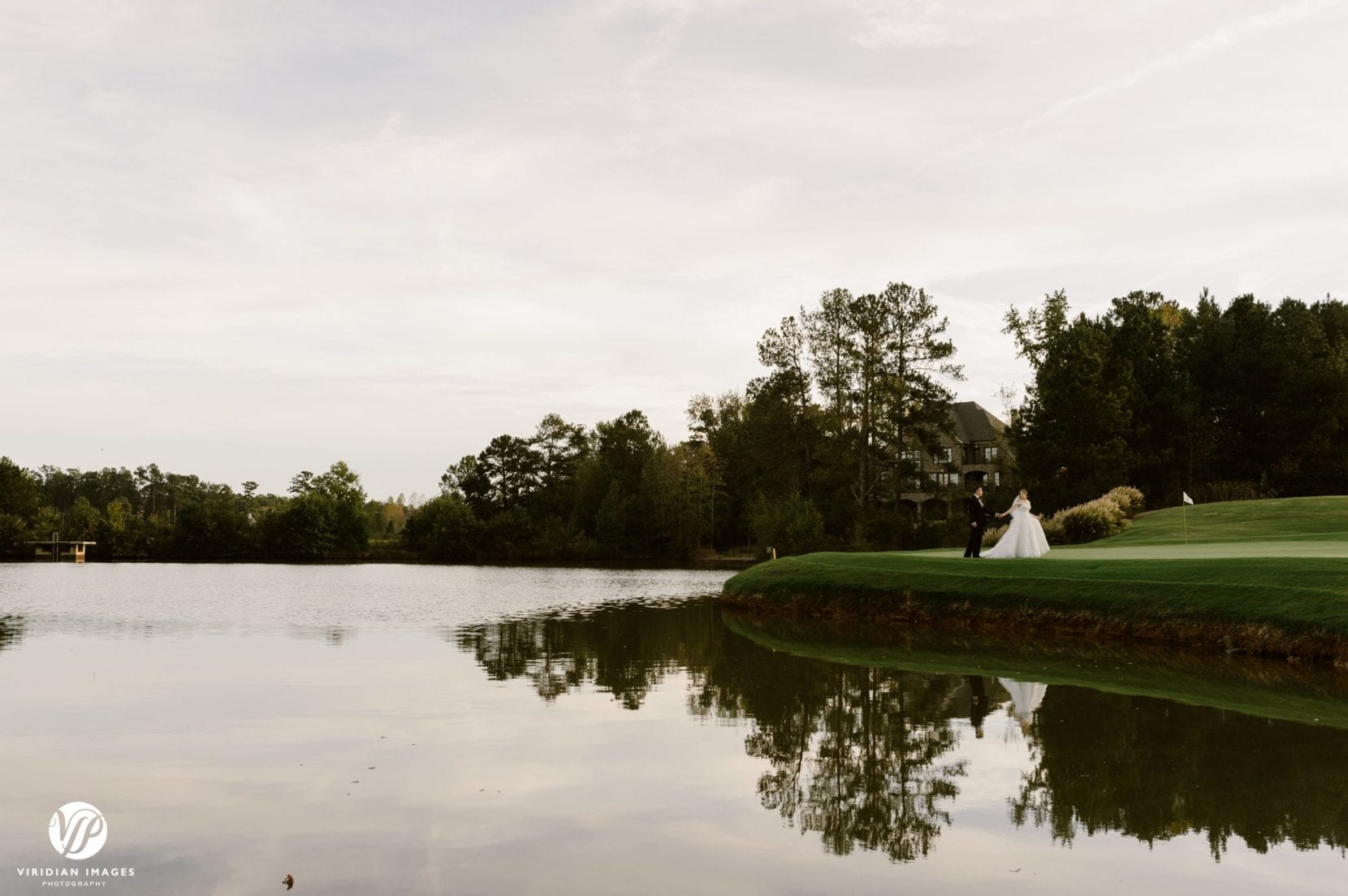 wide shot on golf course near lake