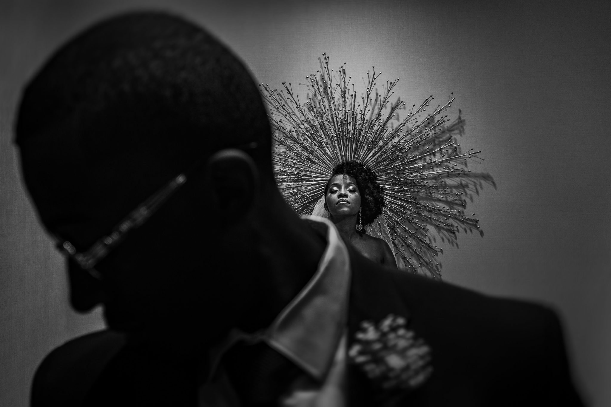 Award-winning indoor wedding portrait of bride and groom in narrow hallway near elevators at Villa Christina
