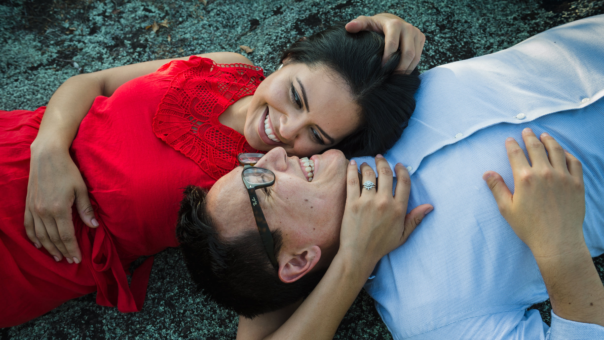 couple lying on shoulder during arabia mountain engagement shoot