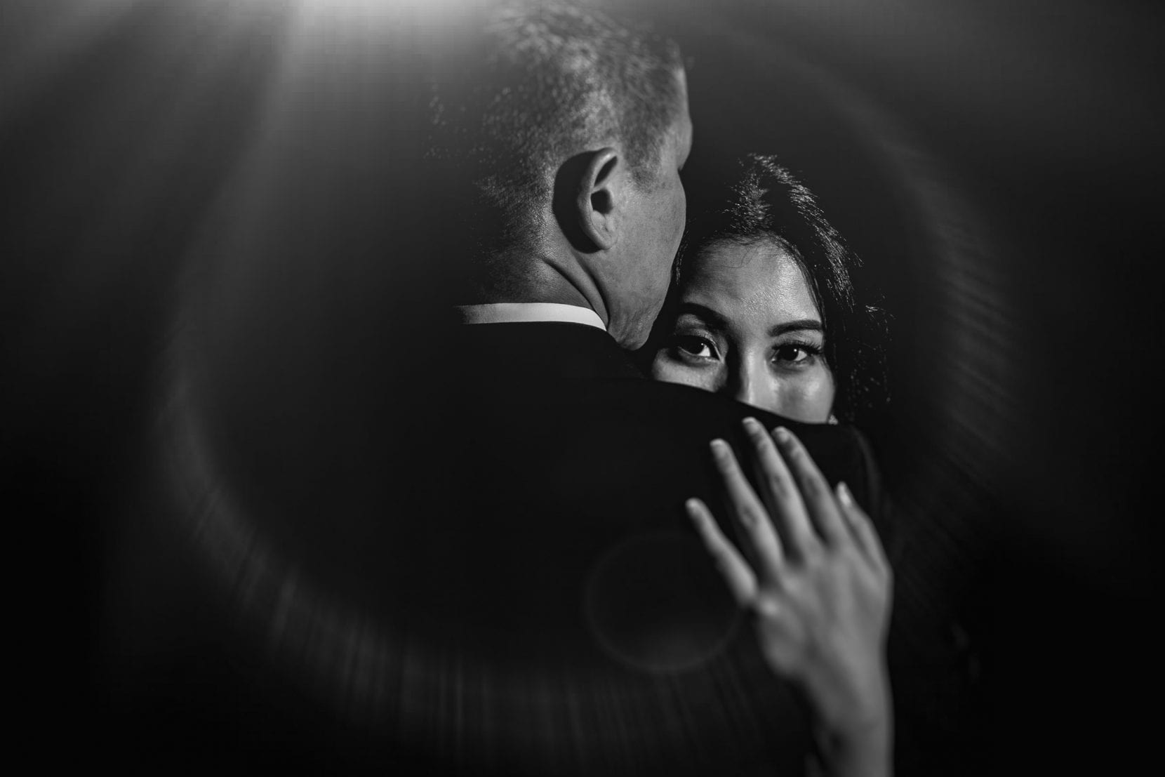 black and white wedding portrait with flare