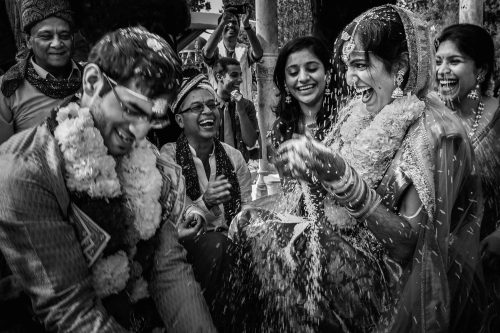 indian couple throwing rice during wedding ceremony in memphis