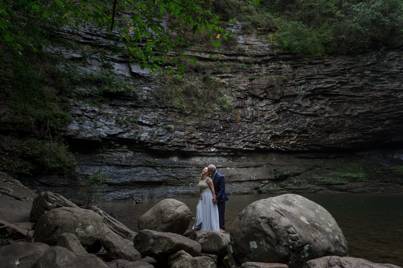 couple front of waterfall cloudland canyon adventure session