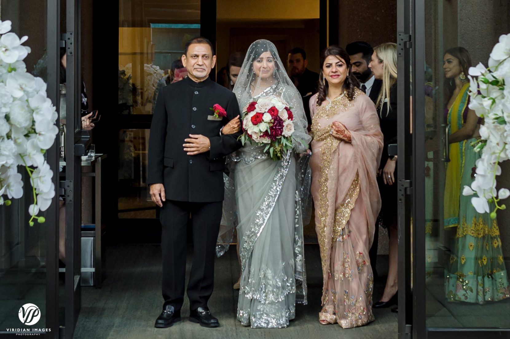 emotional bride coming down aisle