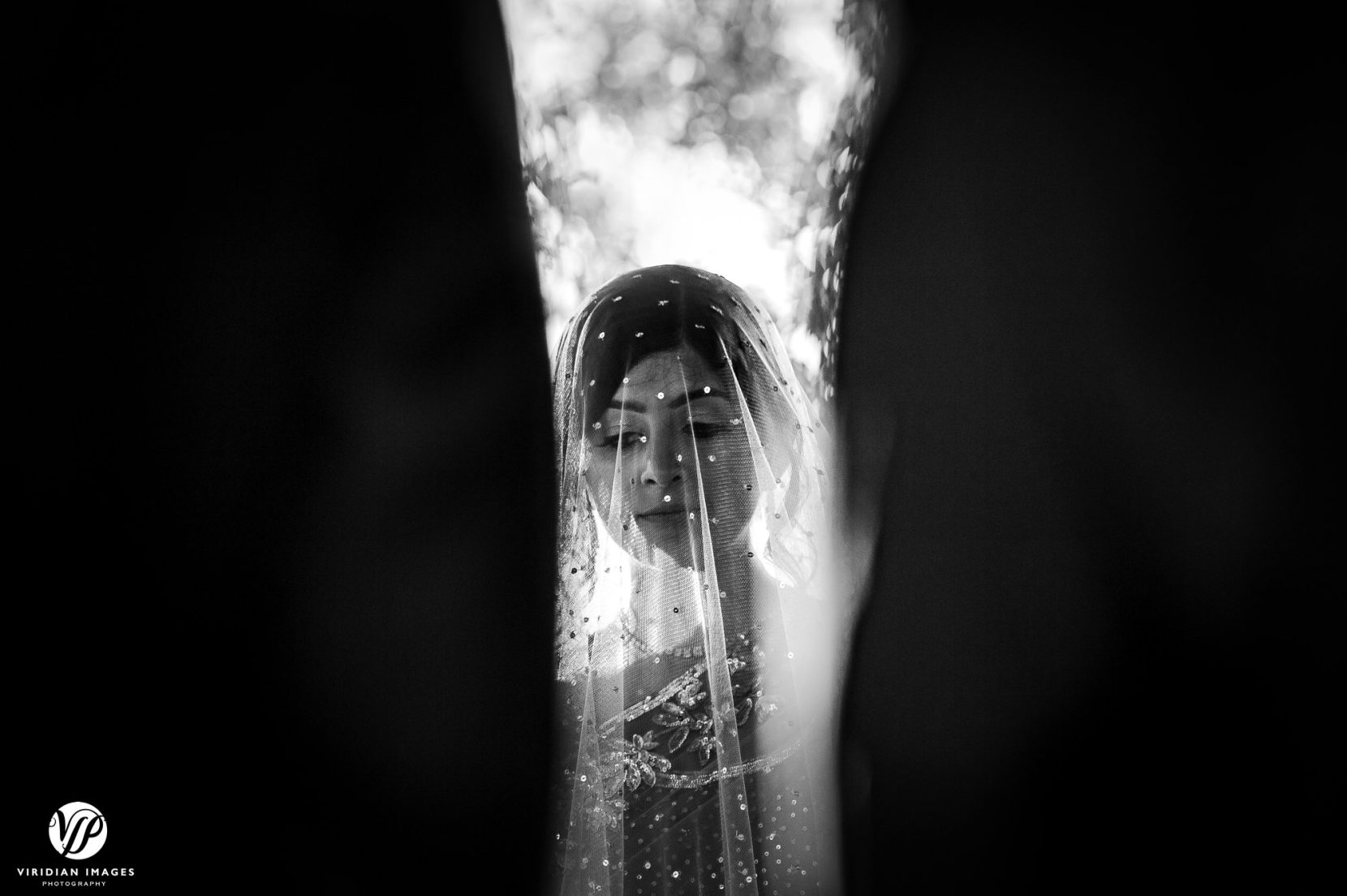bride through officiants during southeast asian ceremony