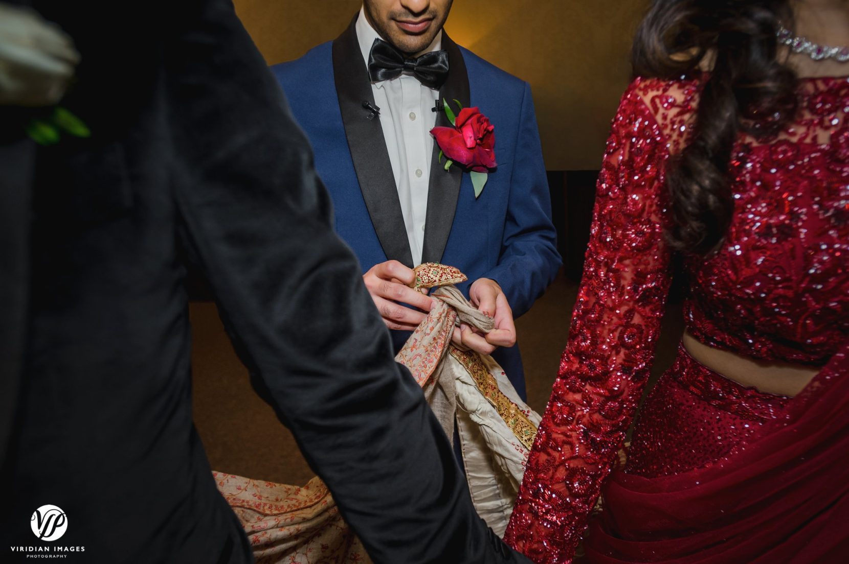 best man ties knot behind couple before grand entrance