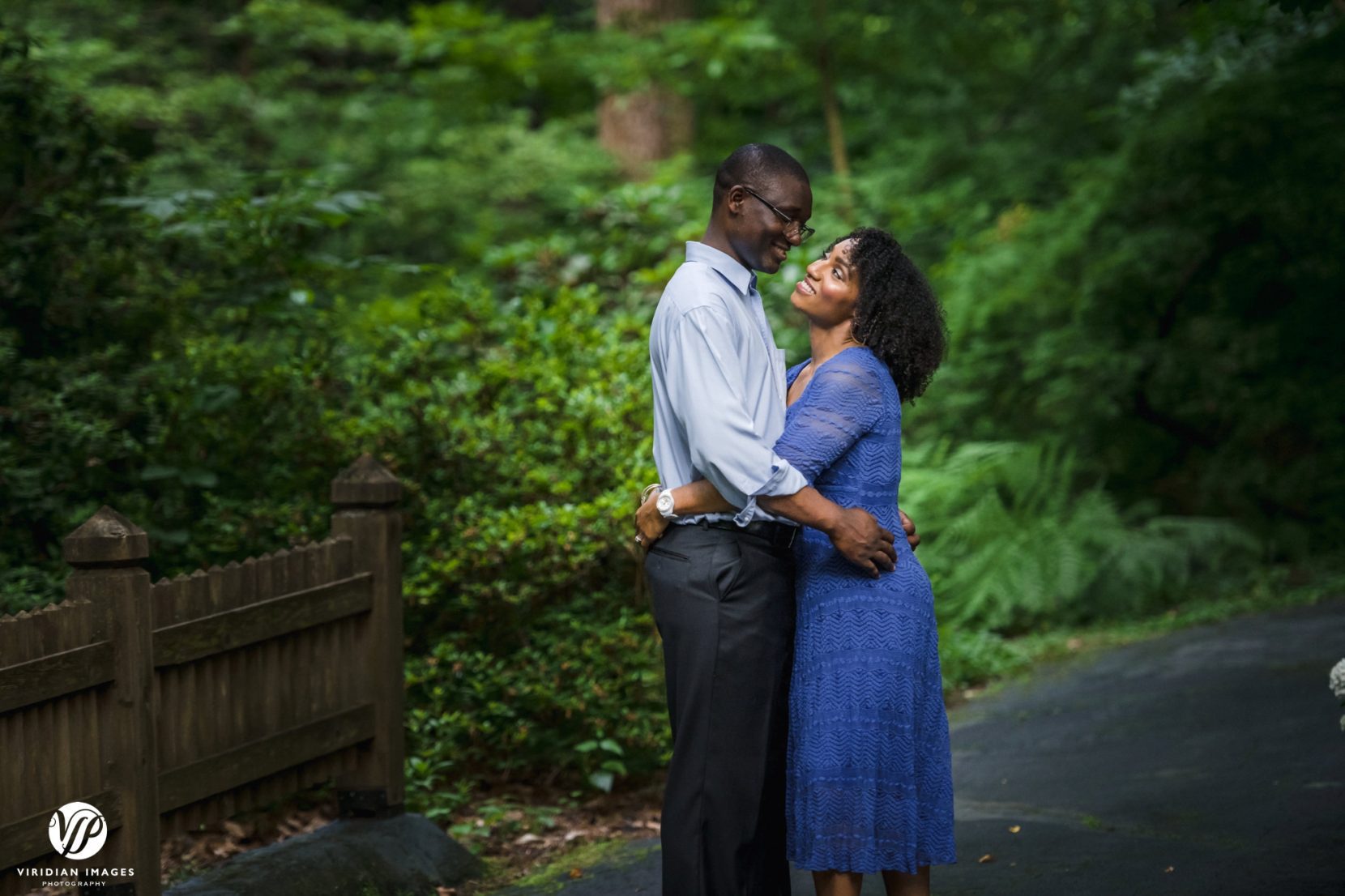 couple smiling at each other in the park