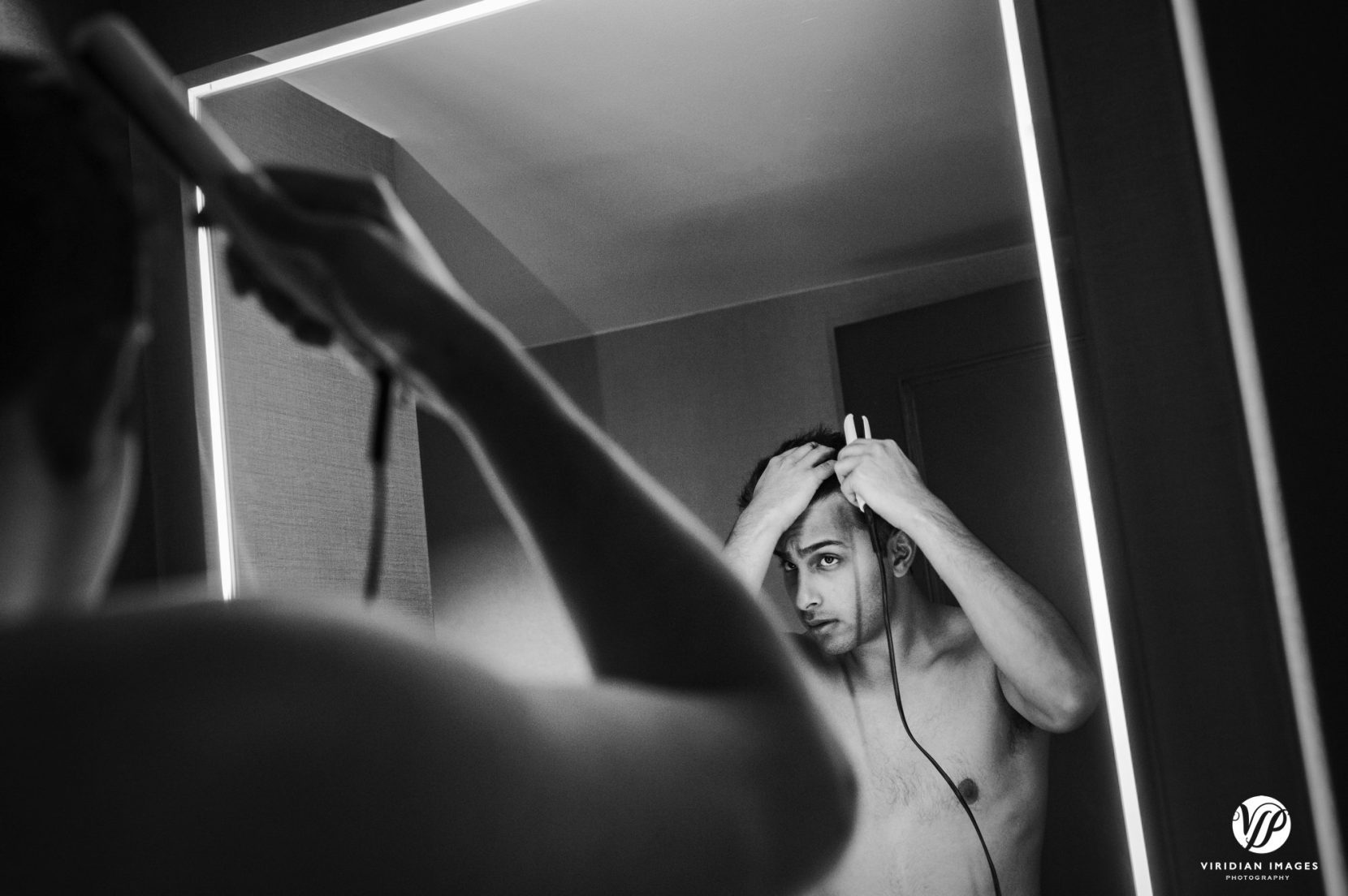 groom flat iron hair bathroom mirror shirtless