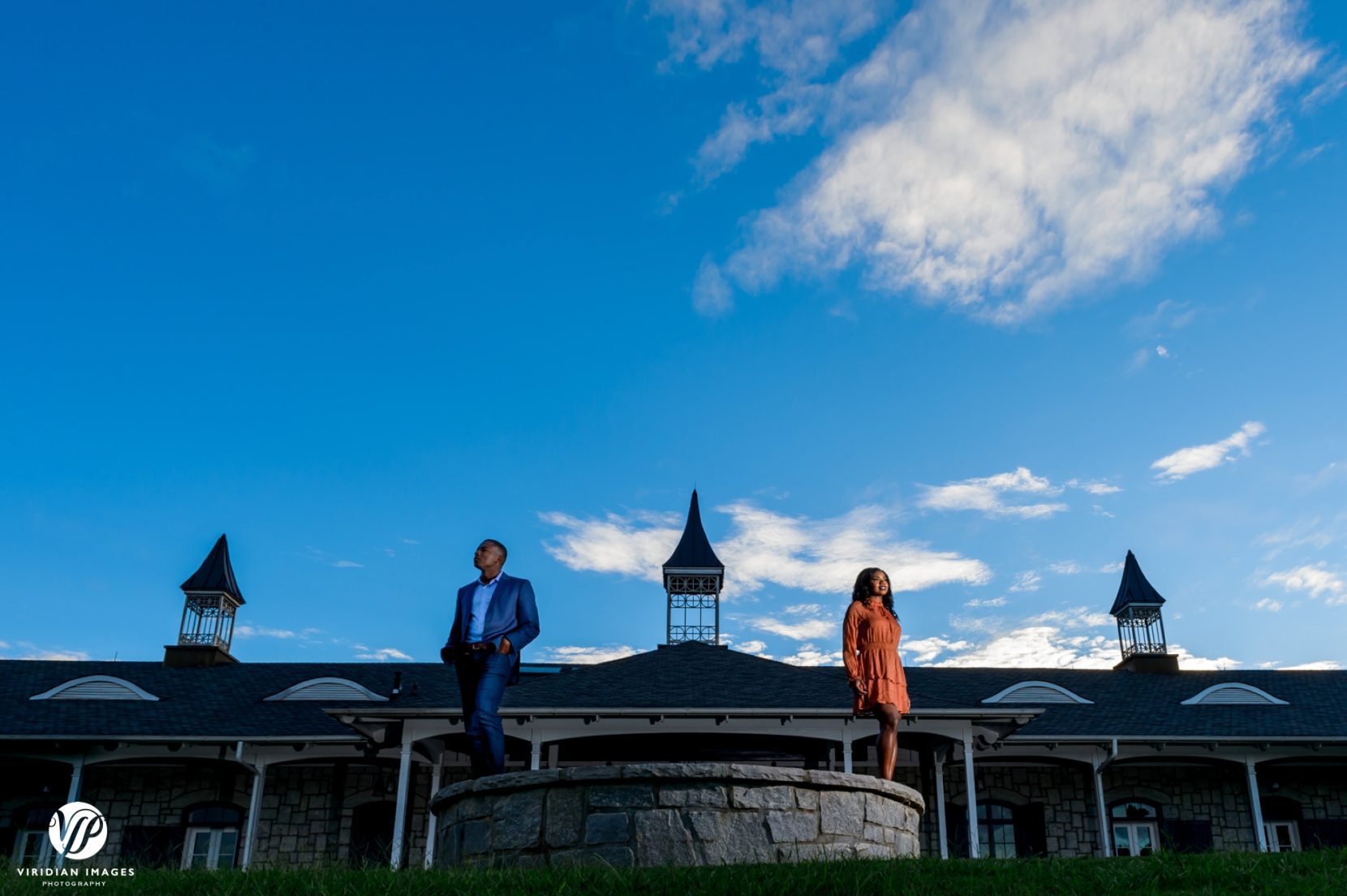 creative angle of couple and foxhall with blue skies