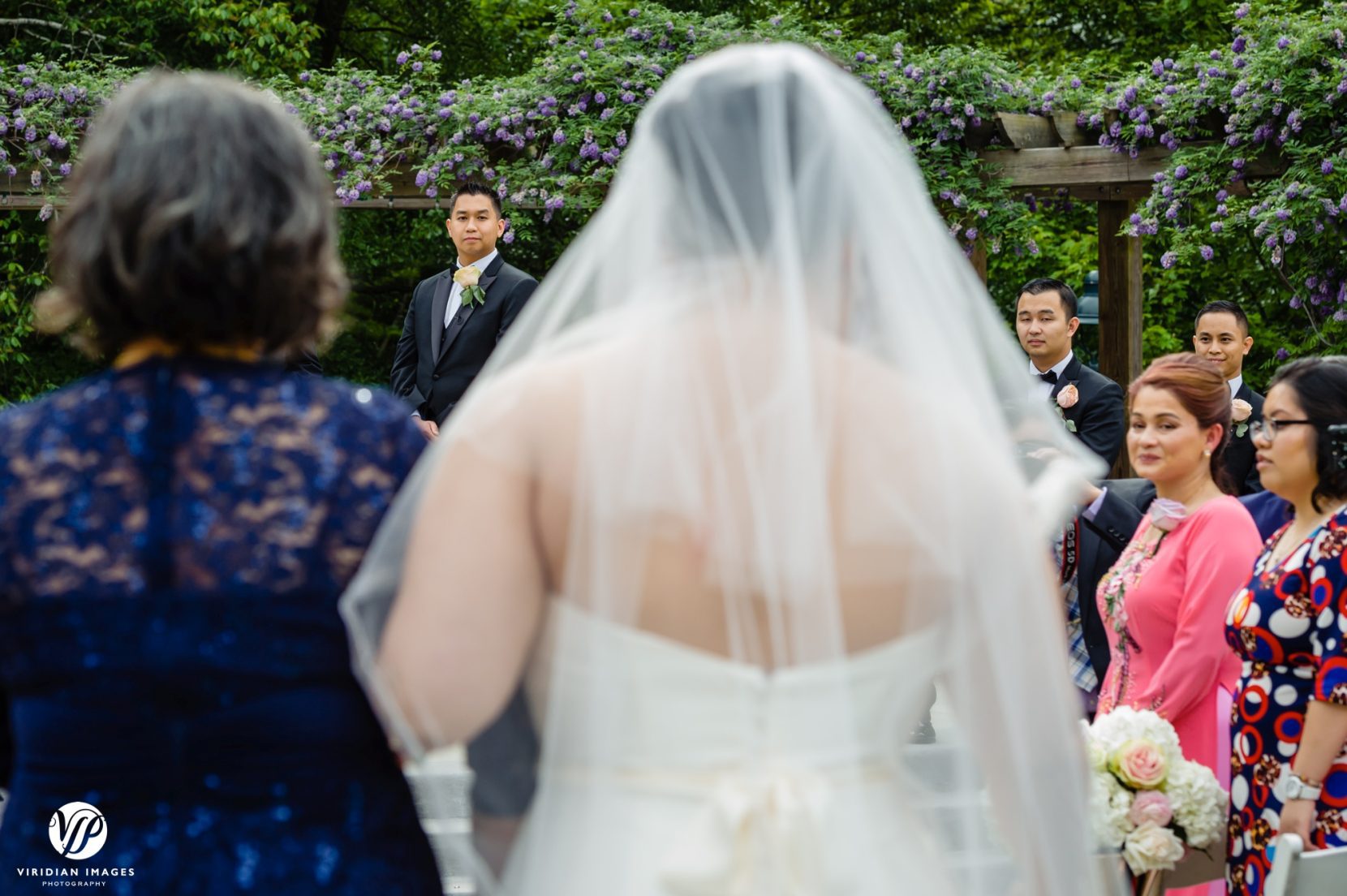 groom seeing bride down aisle