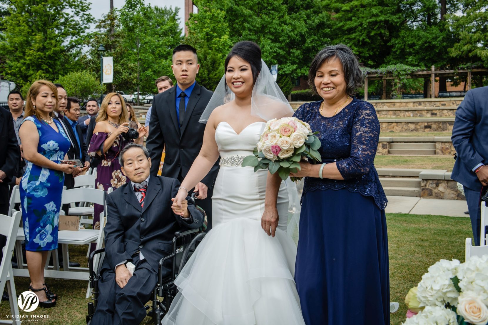 bride with mom and dad in wheelchair