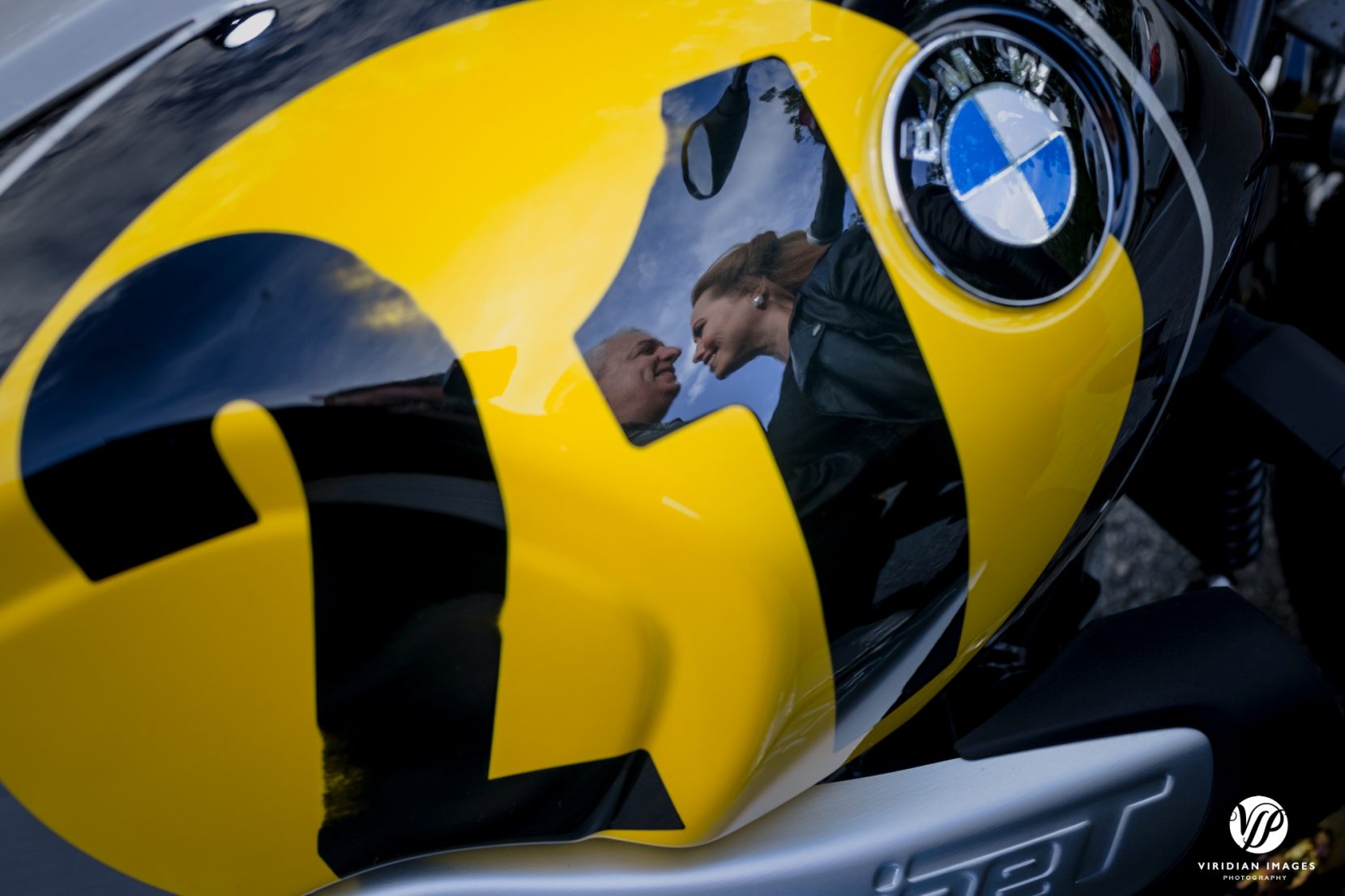 reflection of couple on bmw motorcycle yellow 21 adventure post wedding session at cloudland canyon