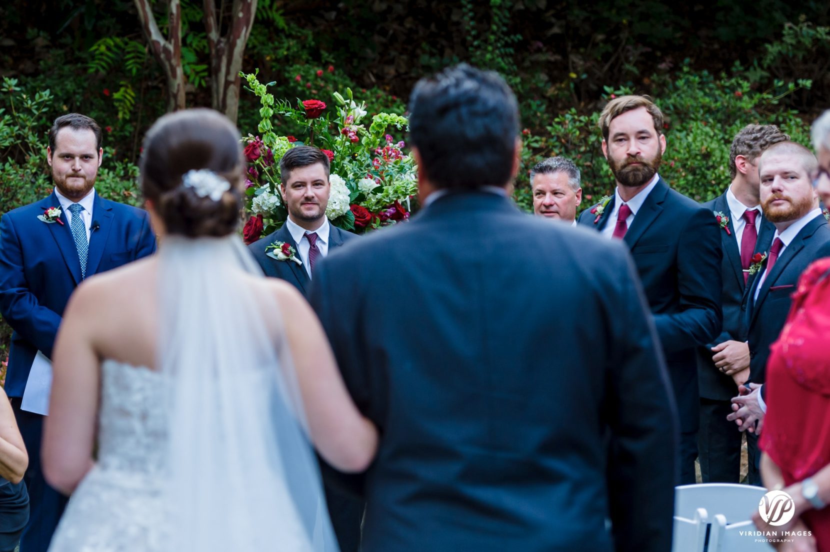 groom looking at bride during wedding processional