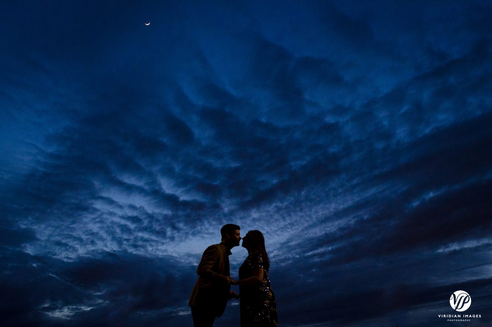 couple silhoette against sky during blue hour