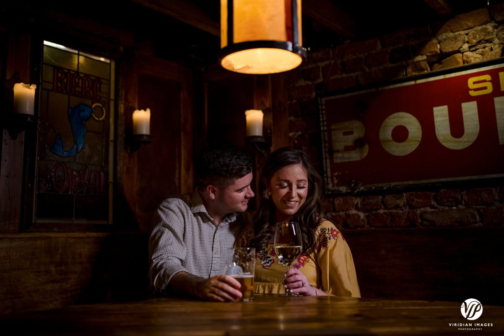 private and romantic moment between couple at bar