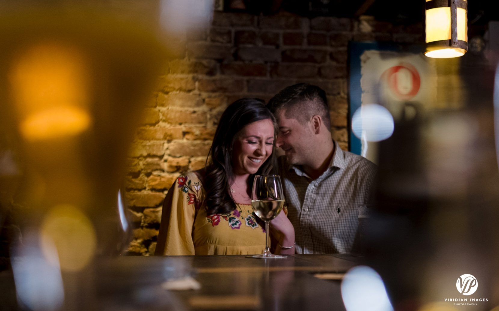 couple enjoying drinks at a bar in Decatur, GA