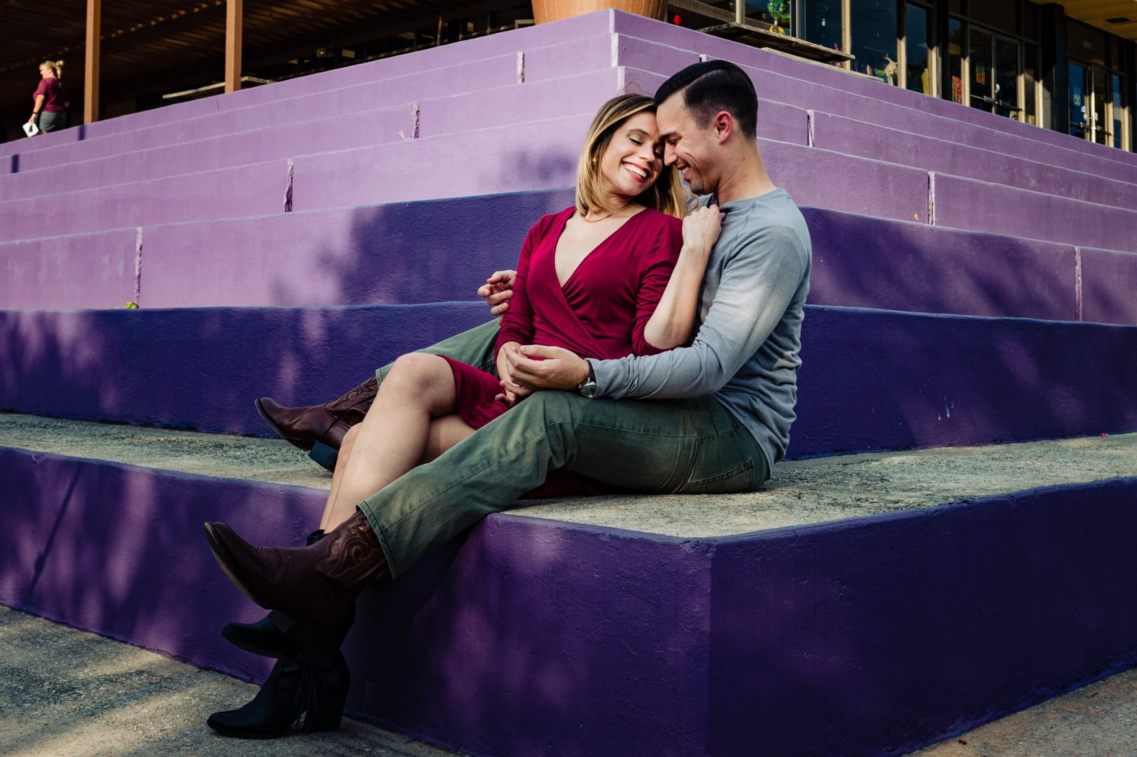 couple sitting on purple concrete corner stairs at Mason Mill Park Decatur, Georgia engagement session photo