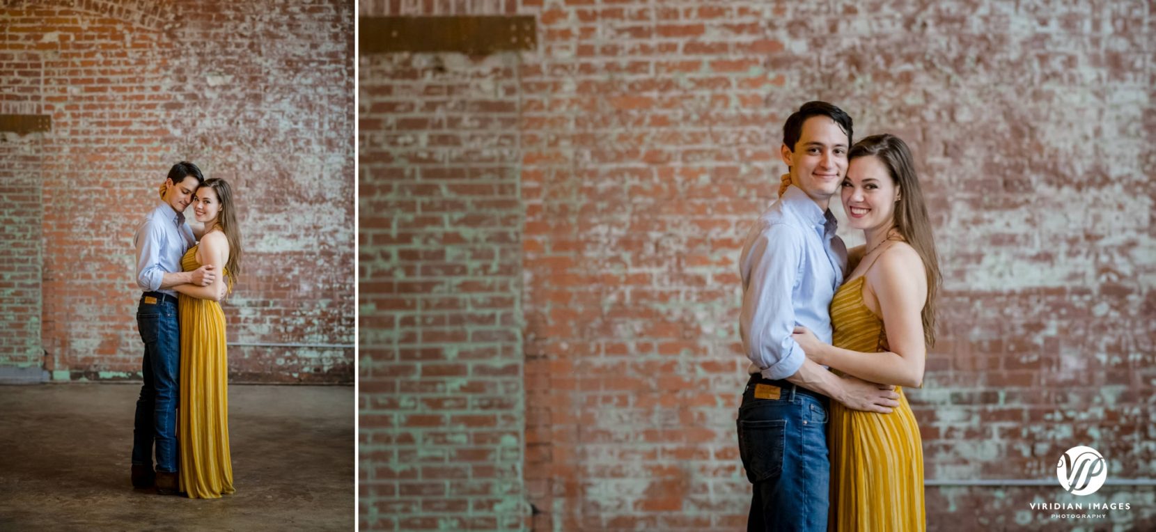 Couple hugging in front of brick wall 
