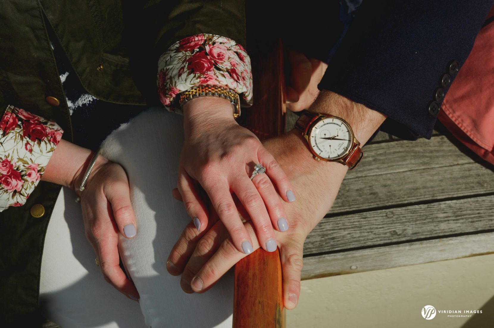 Detail ring shot on sailboat steering tiller during engagement photoshoot on lake lanier