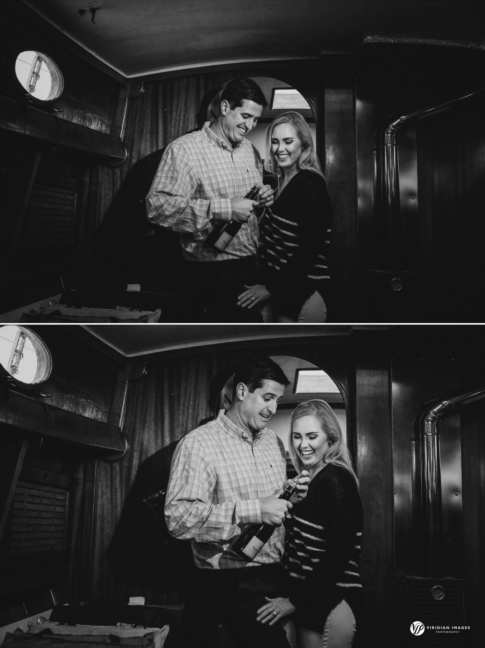 Couple opening up bottle champagne under deck of sailboat during engagement session