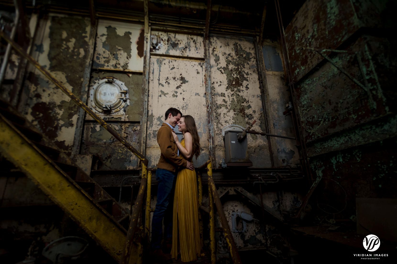 artistic engagement portrait with dramatic lighting at Lindale Mill
