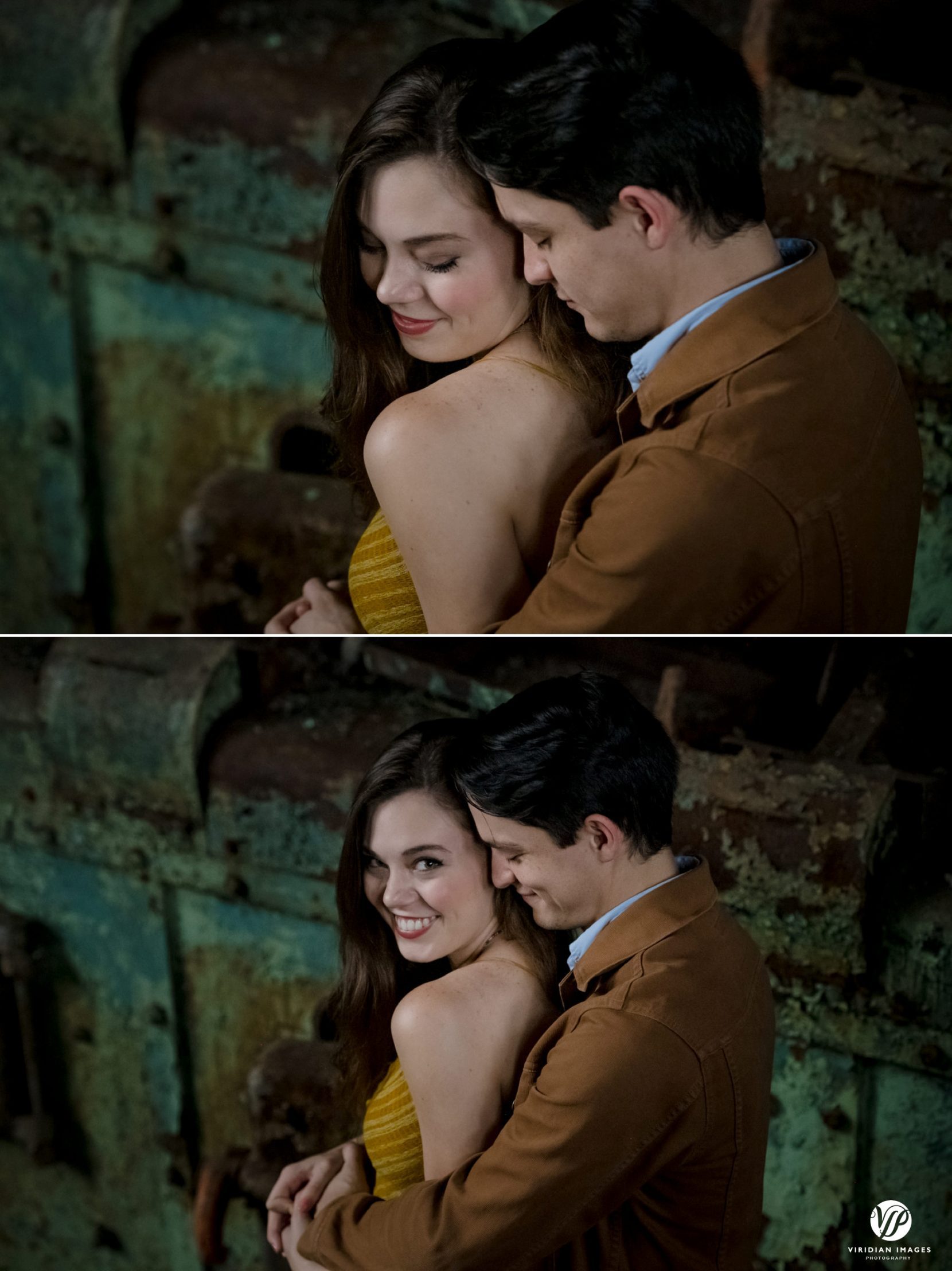 romantic engagement photo of couple in warm embrace in front of rustic mill equipment at Lindale Mill