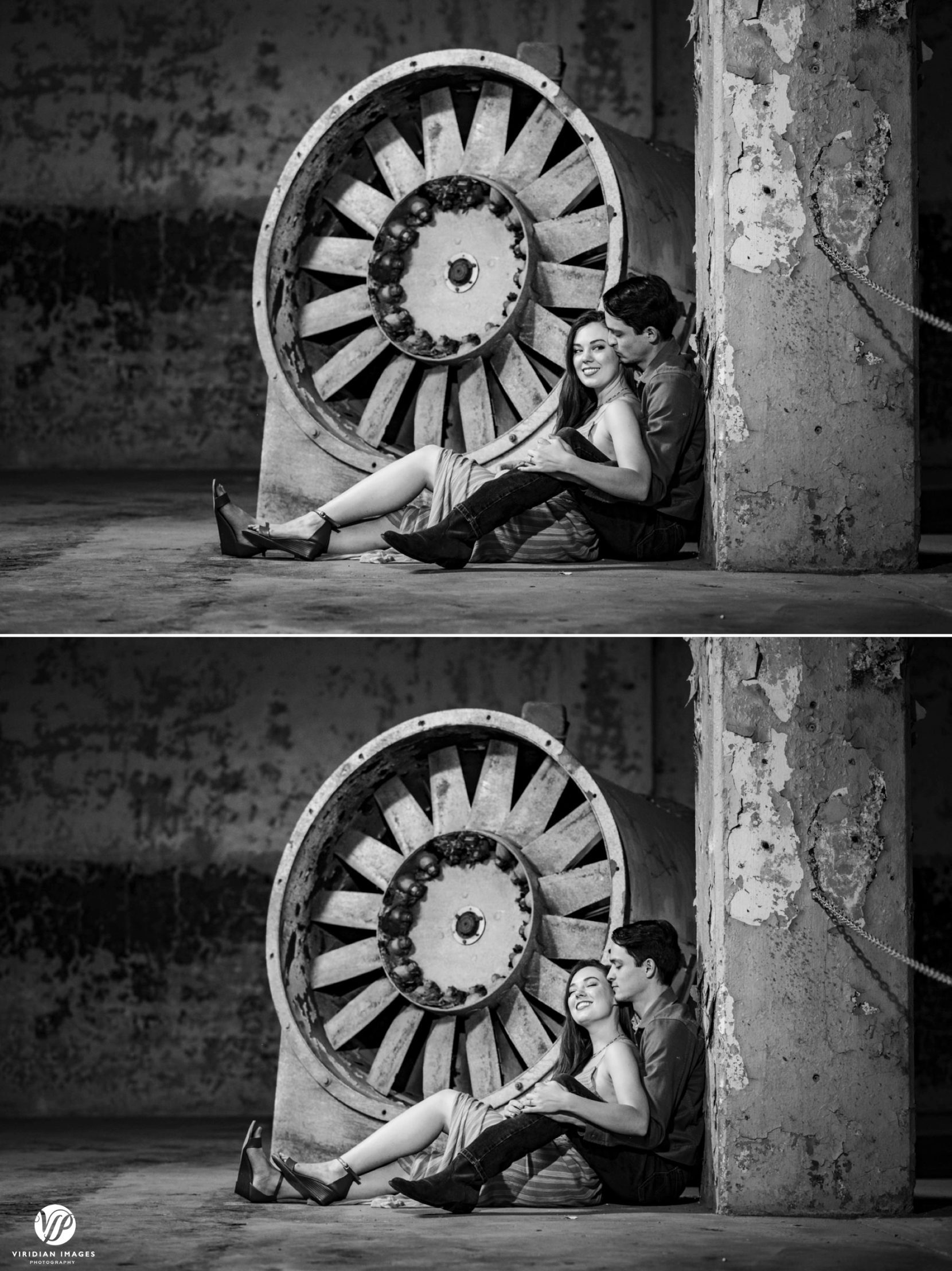 Couple sitting on factory floor in front of turbine during engagement session at Lindale Mill