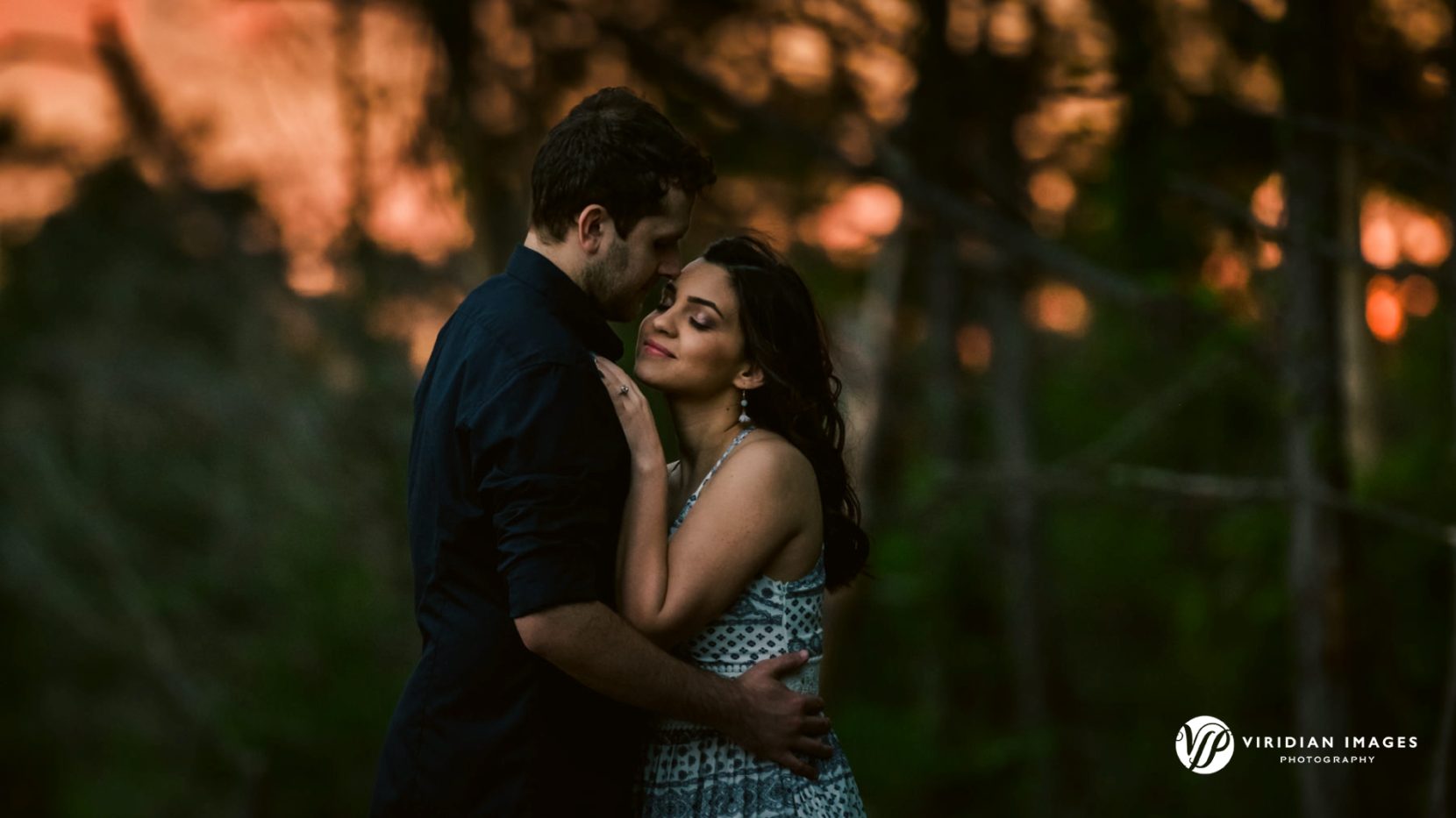 Romantic embrace of engaged couple during spring session