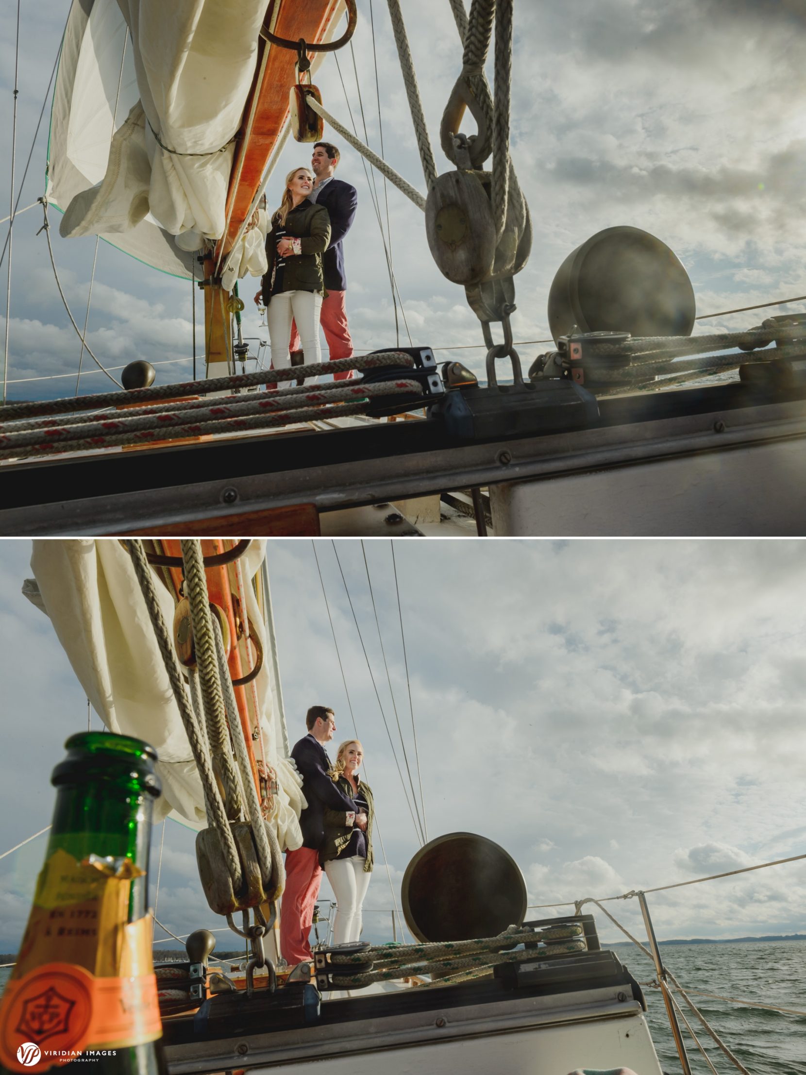 Couple looking out on sailboat during engagement photoshoot as clouds break showing oncoming sun