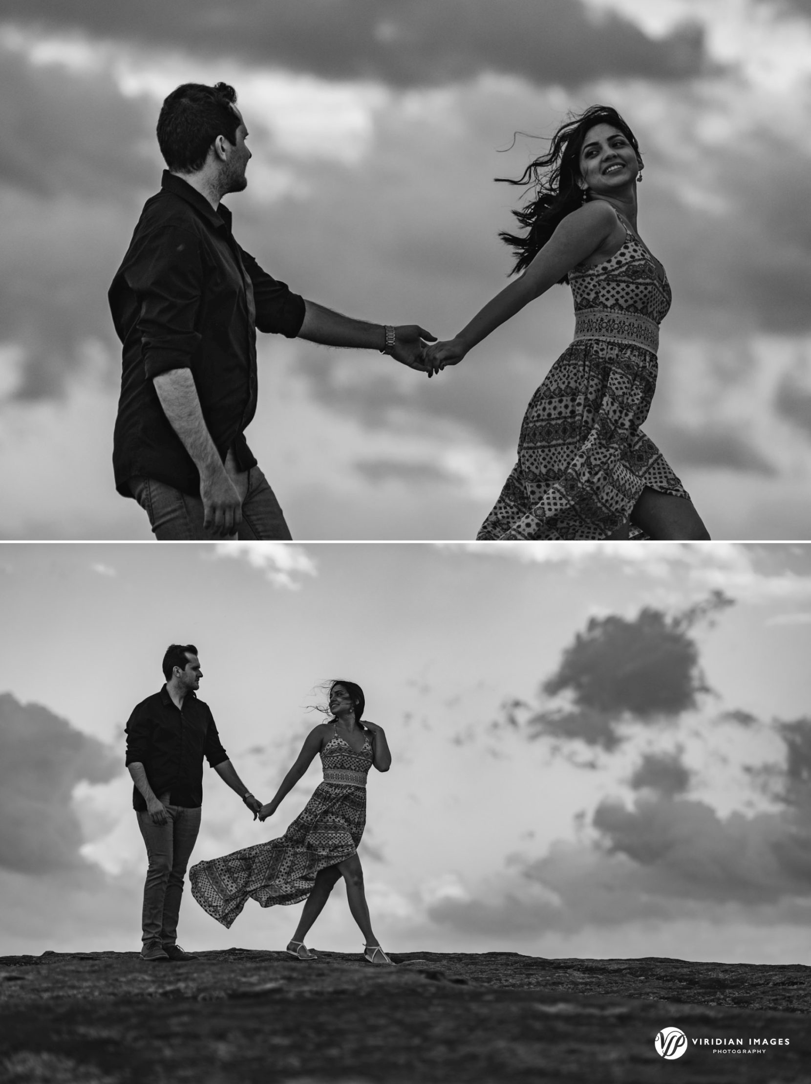 Couple walking hand in hand across granite terrain with panoramic spring views