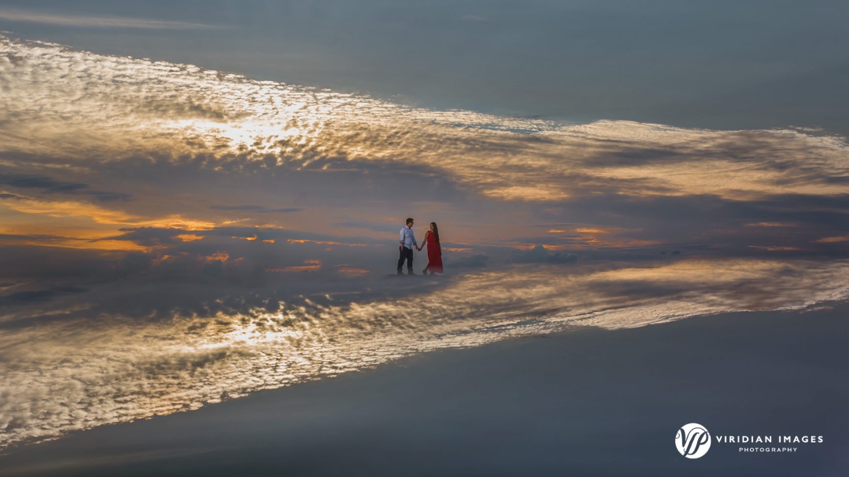 sky reflection with couple in the middle during golden hour atop Arabia Mountain