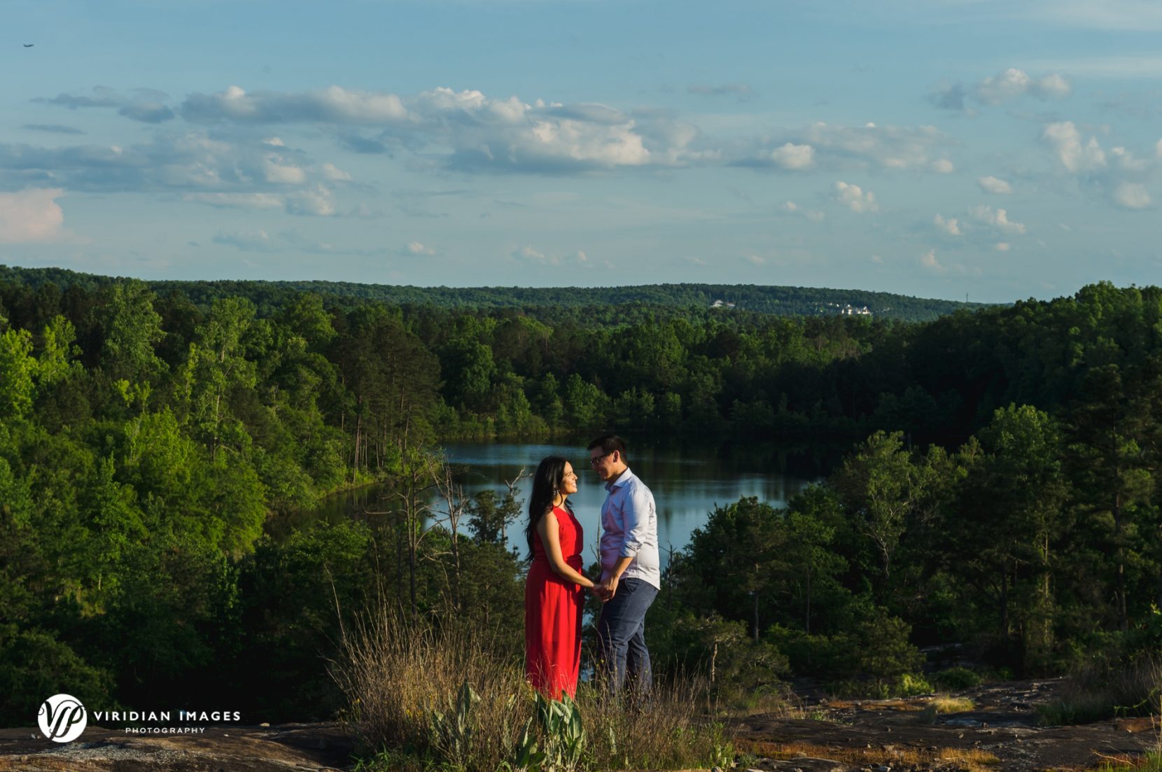 engagement session in front of lake on Arabia Mountain