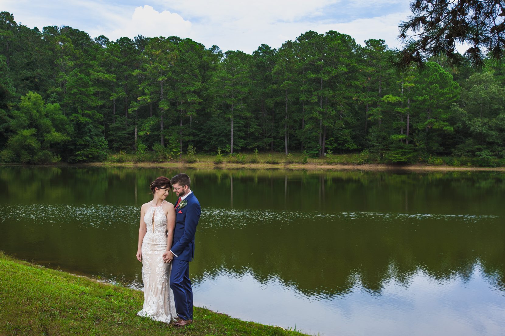 wedding couple portrait moment in front of lake at Daisy Hill