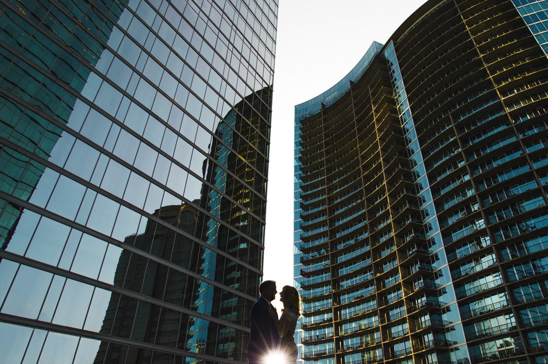 bride and groom silhouette between two buildings during golden hour in Atlanta by Viridian Images Photography