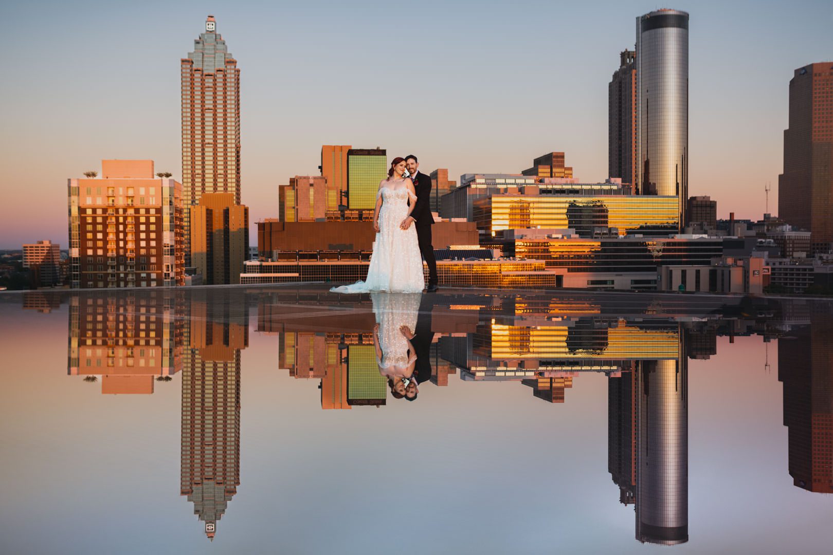 creative portrait on top of Ventanas helipad with atlanta city skyline during golden hour with reflection
