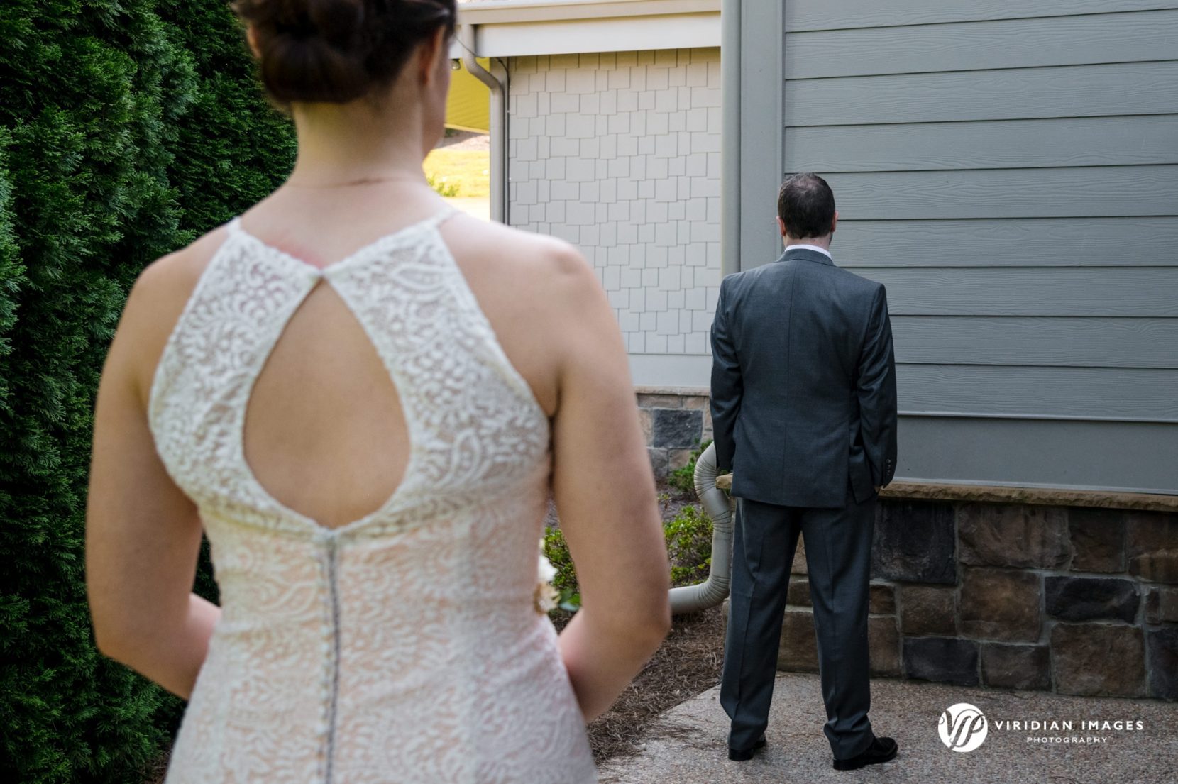 Bride approaching groom during first look at Yonah Mountain Vineyarad