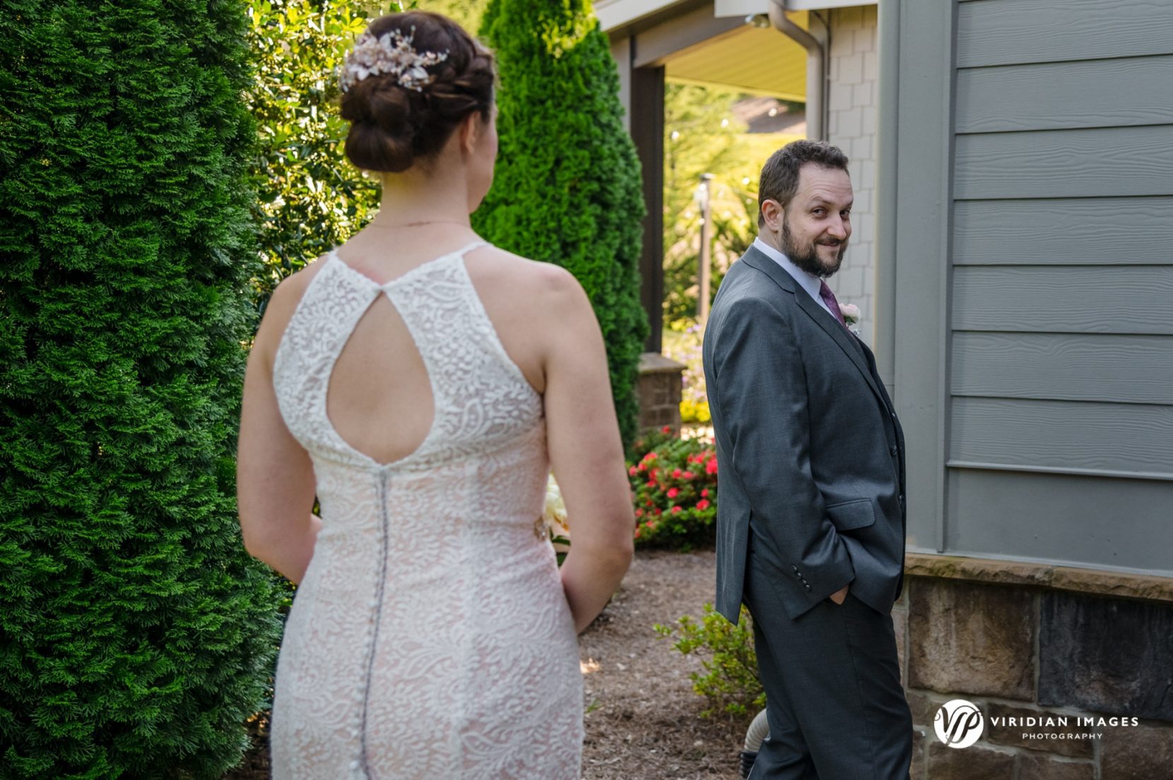 Groom first glimpse of bride during first look at Yonah Mountain Vineyeard