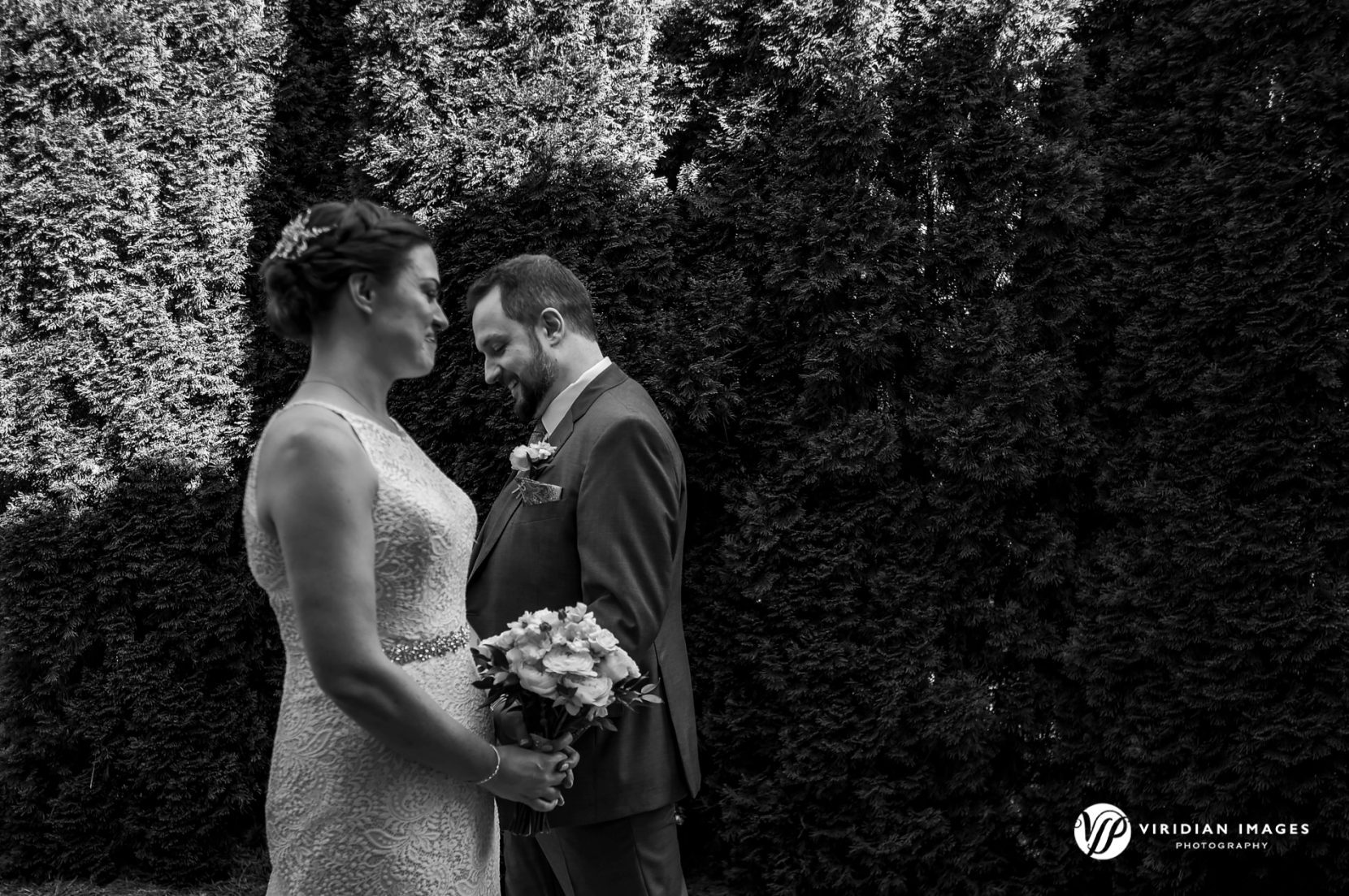 Editorial style candid photo of bride and groom walking past each other at Yonah Mountain Vineyarad