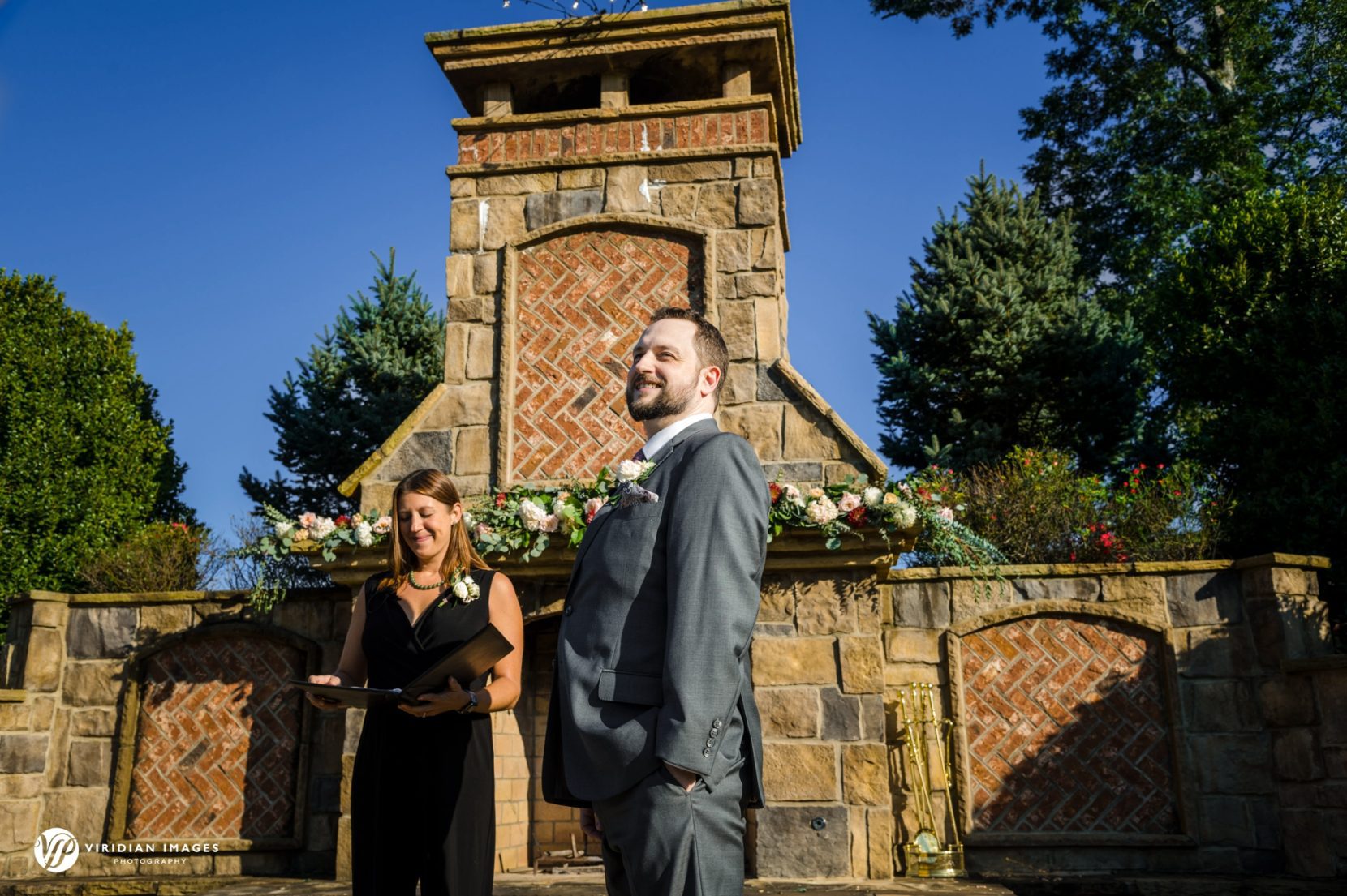 Groom first look at bride during ceremony at Yonah Mountain Vineyard