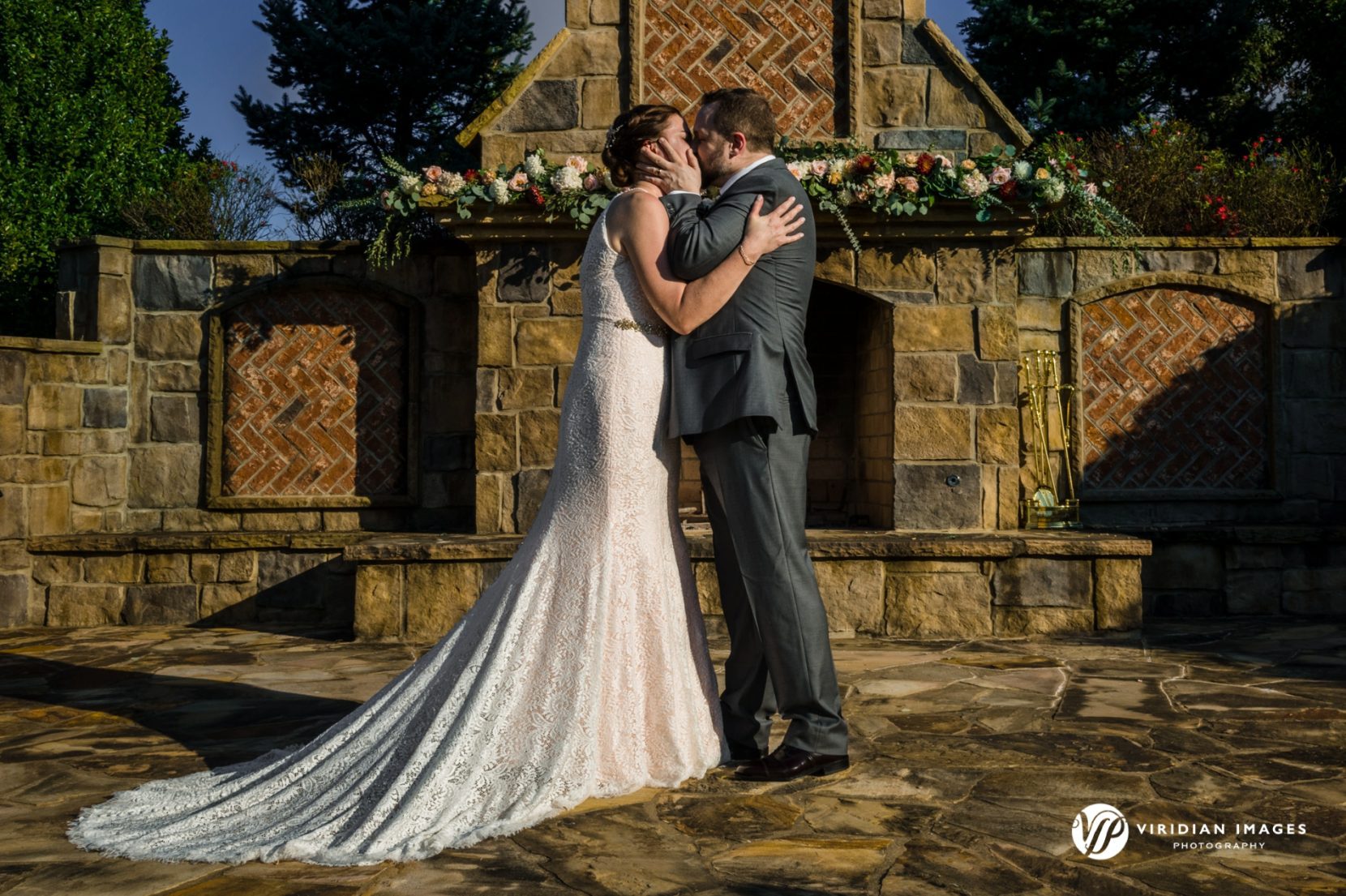 Bride and Groom kissing at ceremony site after wedding at Yonah Mountain Cleveland Georgia
