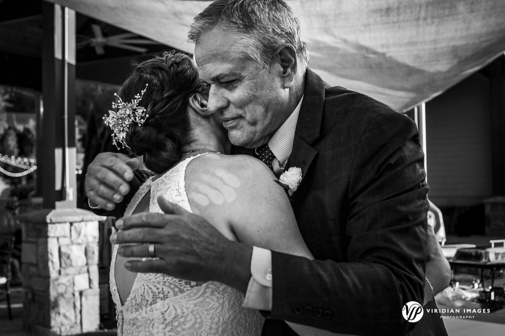 Father of Bride hugging bride after toast