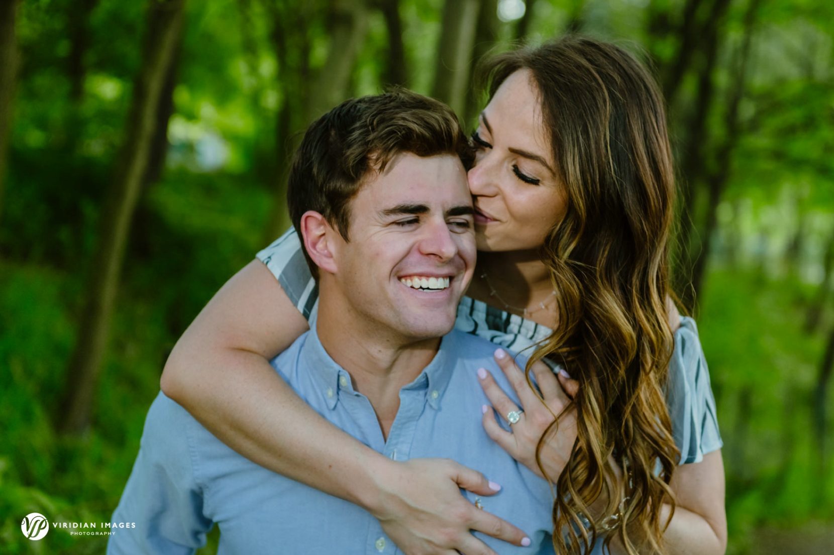 Piggy back during late afternoon engagement session at Piedmont Park