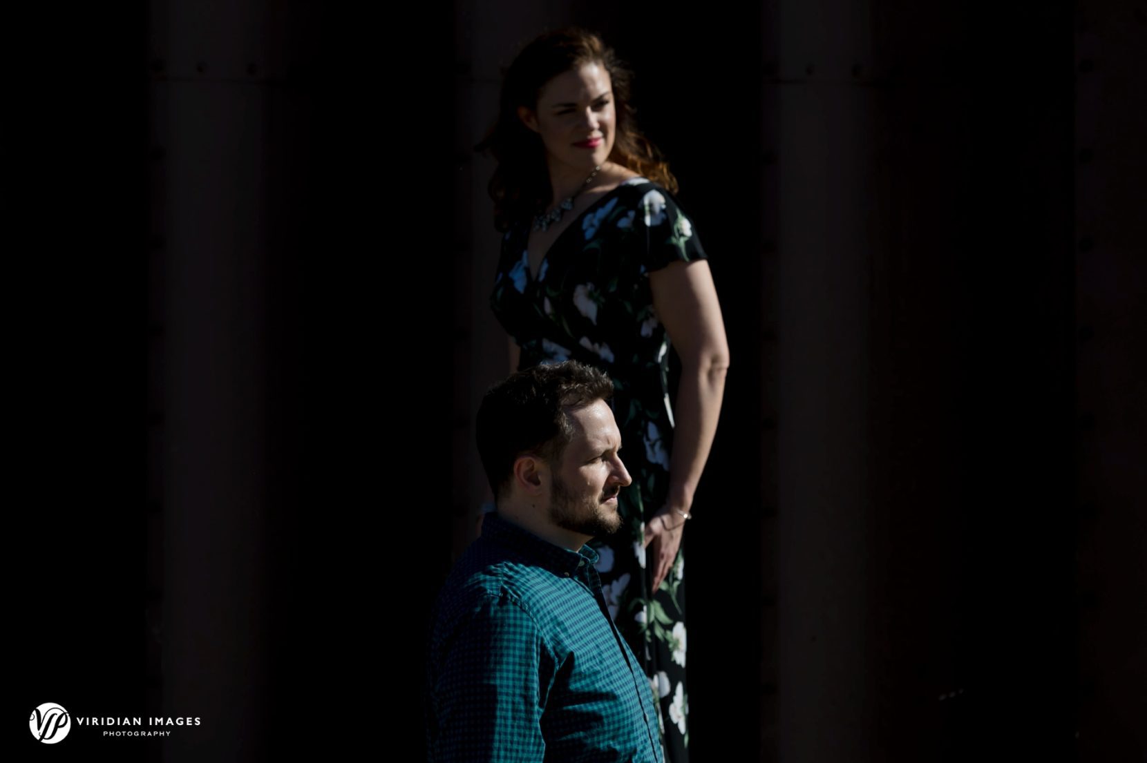 Editorial styled photo of Stephanie and Michael in front of barn at The Cottage Vineyard & Winery engagement session