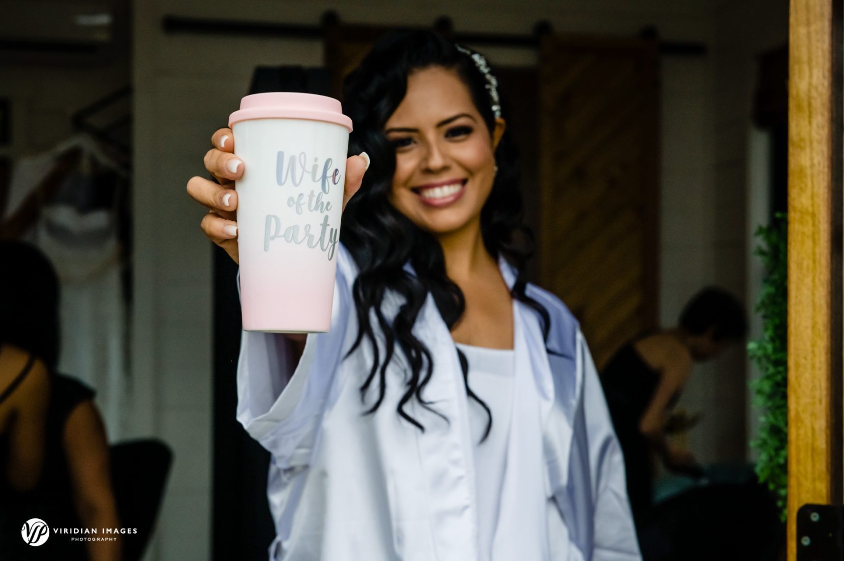 Bride showing off her custom mug while getting ready at Meadows at Mossy Creek wedding